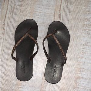 “Leather” braided flip flops